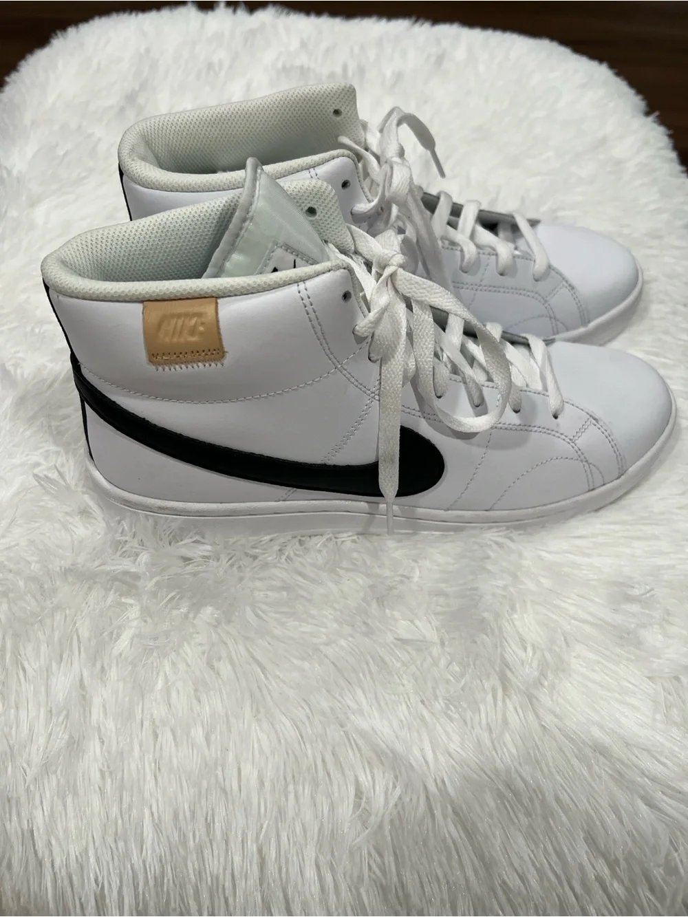 Nike White High-Top Sneakers with Black Swoosh and Tan Heel Tab